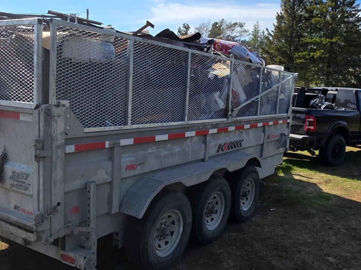 TCM Junk Removal trailer loaded with furniture and household junk after a Sudbury cleanout